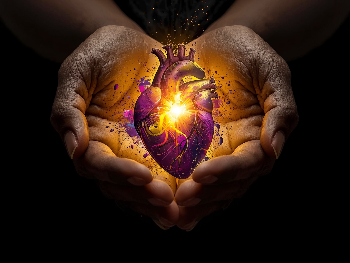 Abstract symbolic image of graceful hands holding a glowing heart